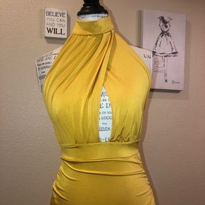 Cause a scene in this Golden Spandex Mini